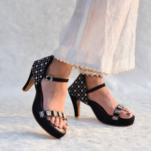 Black ankle strap heels with grid metallic pattern on back panel