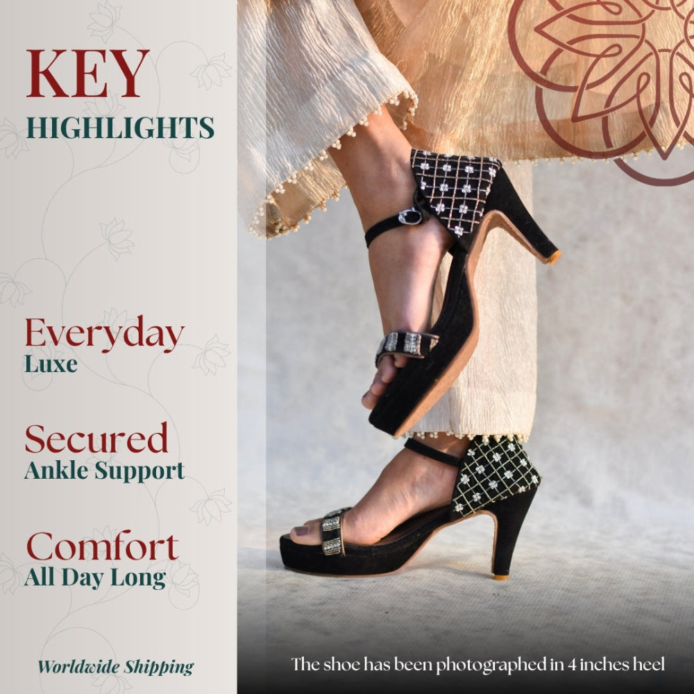 Black high-heeled shoes with ankle straps textured detailing