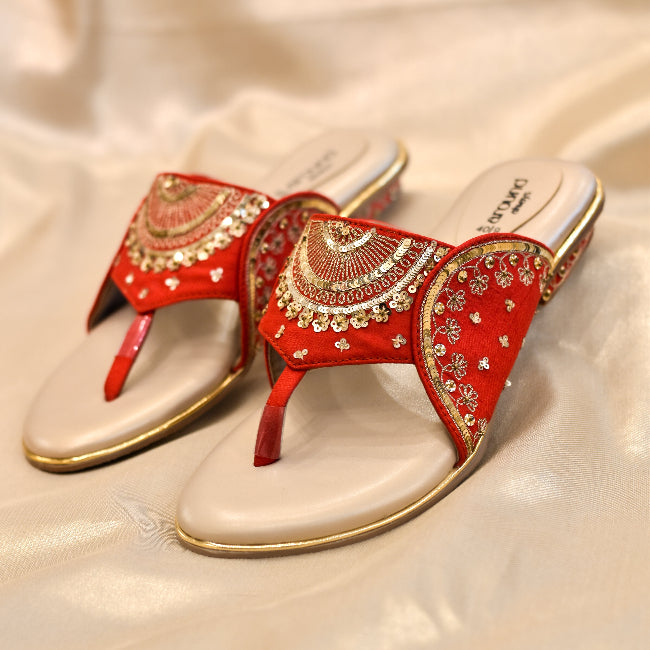 Red kolhapuri style bridal heels with embroidered half circle motif and toe grip
