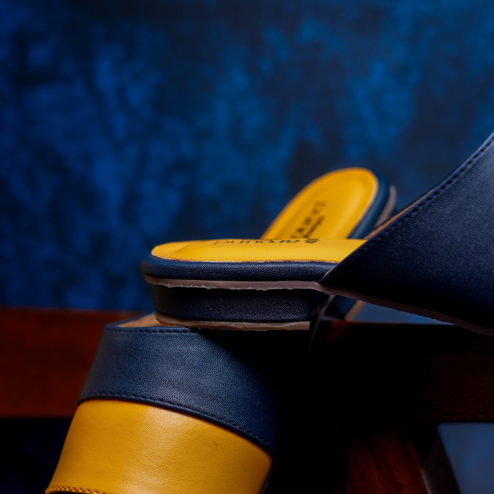 Blue and yellow color-block mule with a clean, modern look.