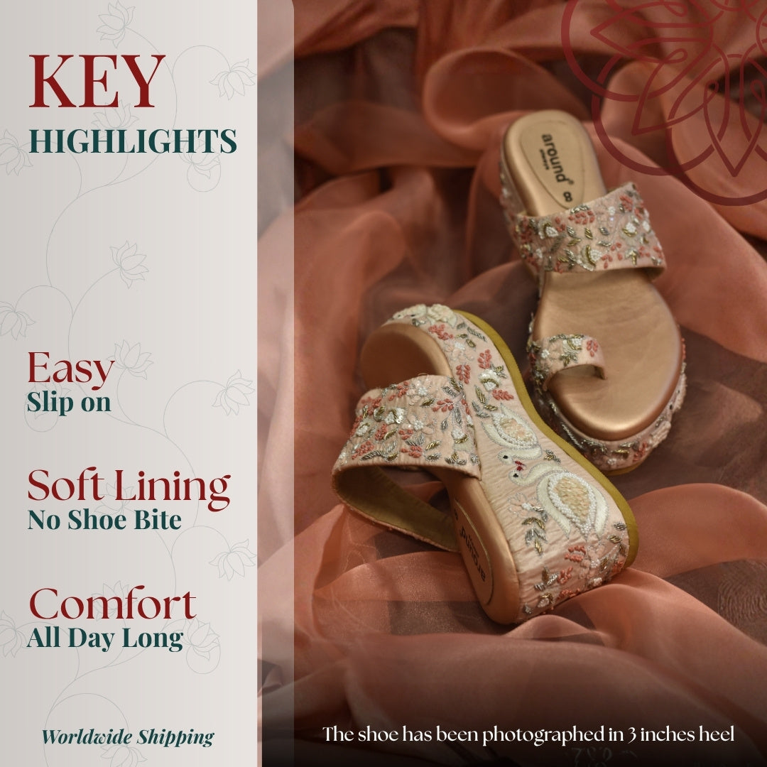 Beige wedge sandals with floral embroidery and toe ring detail, soft lining and slip on comfort styling