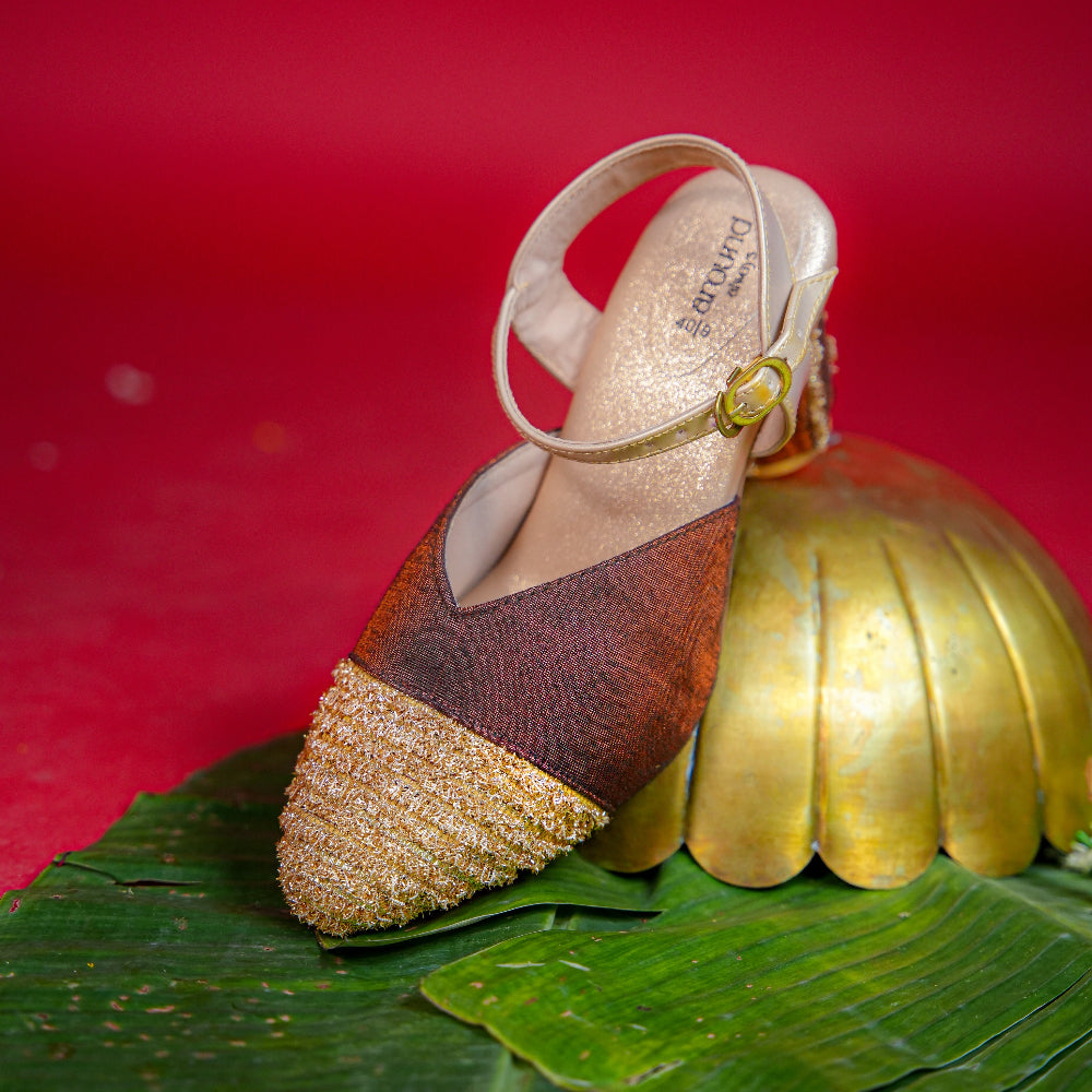 Brown and antique gold slingback heel with textured golden toe
