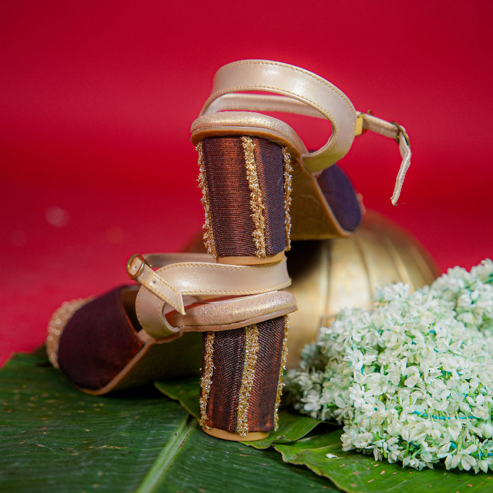 Traditional inspired brown slingback with golden textured toe and block heel
