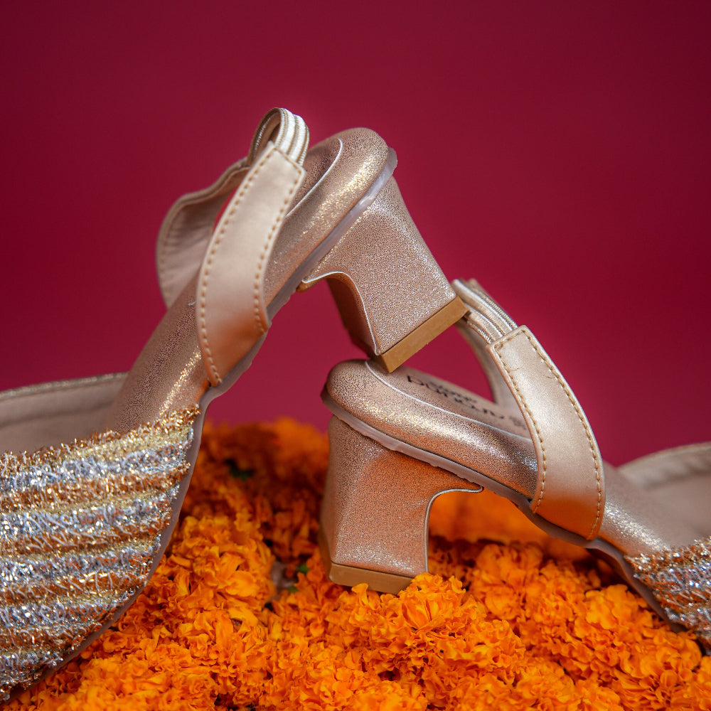 Close-toe mule with gold and silver striped textile detailing
