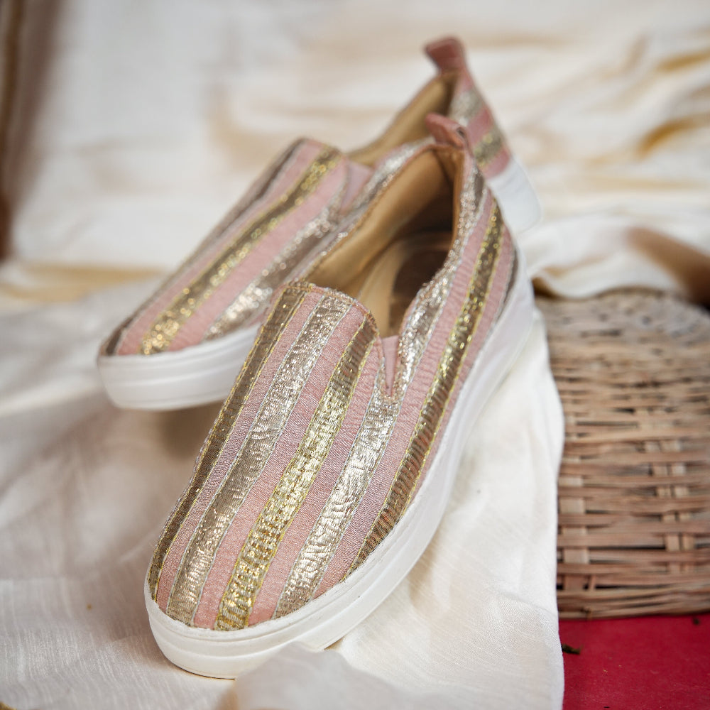 Pink festive sneaker featuring vertical gold and silver textile bands
