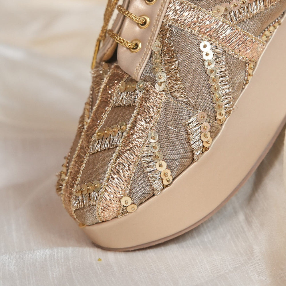 Festive gold wedding sneaker with cushioned footbed and wedge sole