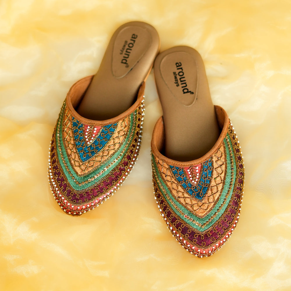 Festive pointed slip-on mule with layered multicolour embroidery and metallic detailing
