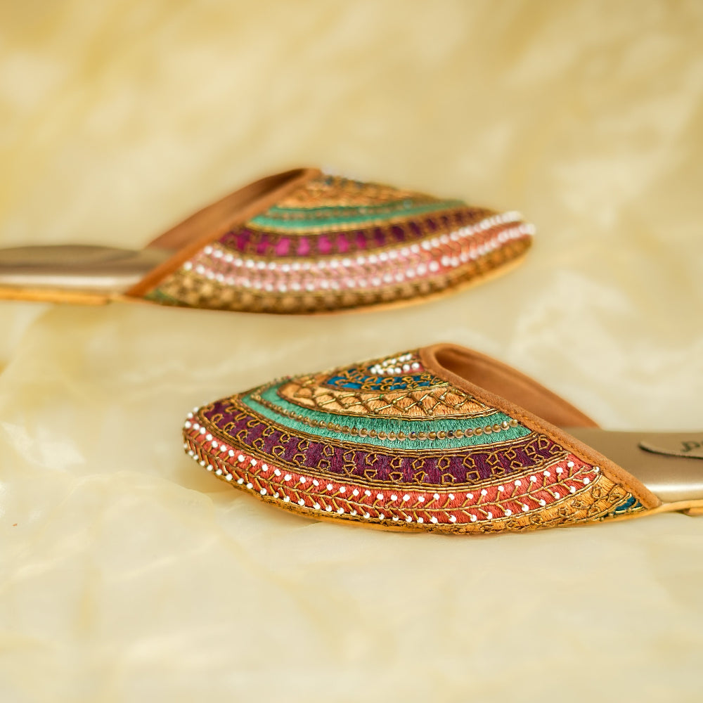 Colourful pointed flat mule with traditional embroidery and cushioned footbed

