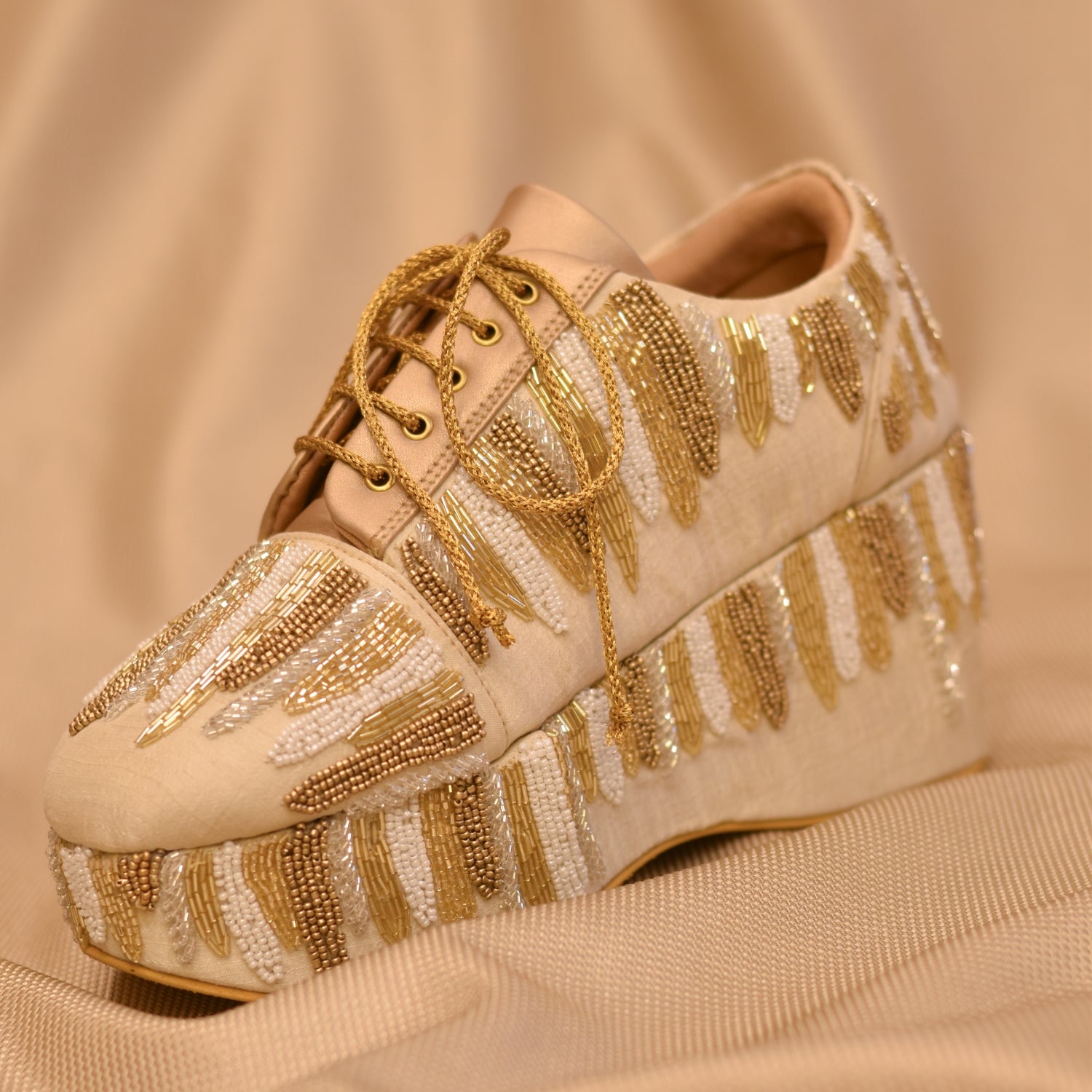 Stylish party sneakers in golden colour