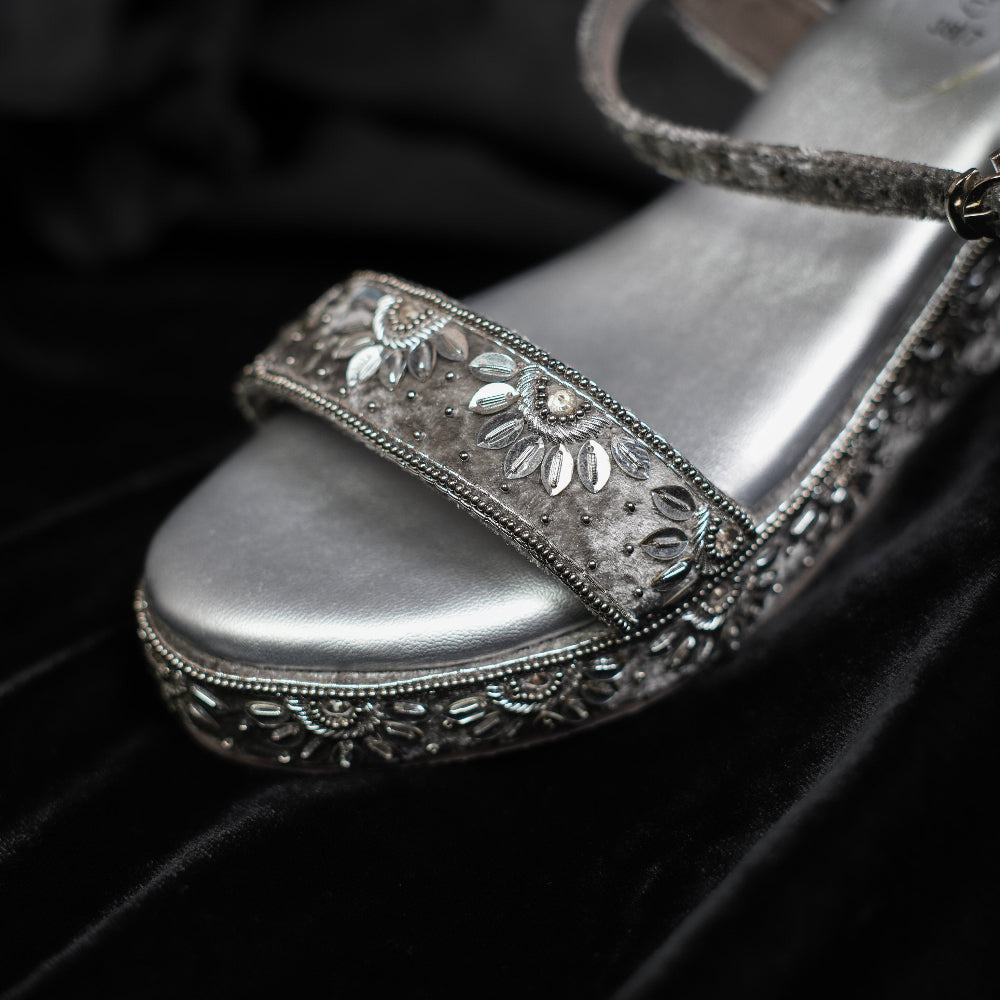 Women’s silver embellished sandals with detailed platform sole
