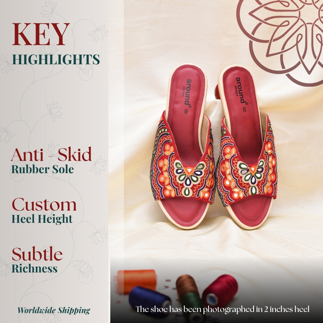 Traditional red block heels with intricate embroidery and cushioned footbed