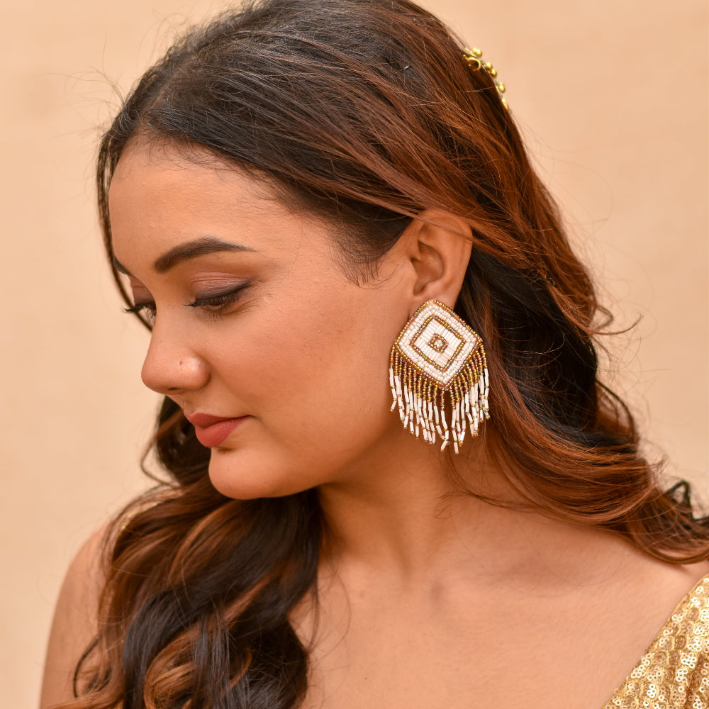 Gold and white beaded earrings for haldi look
