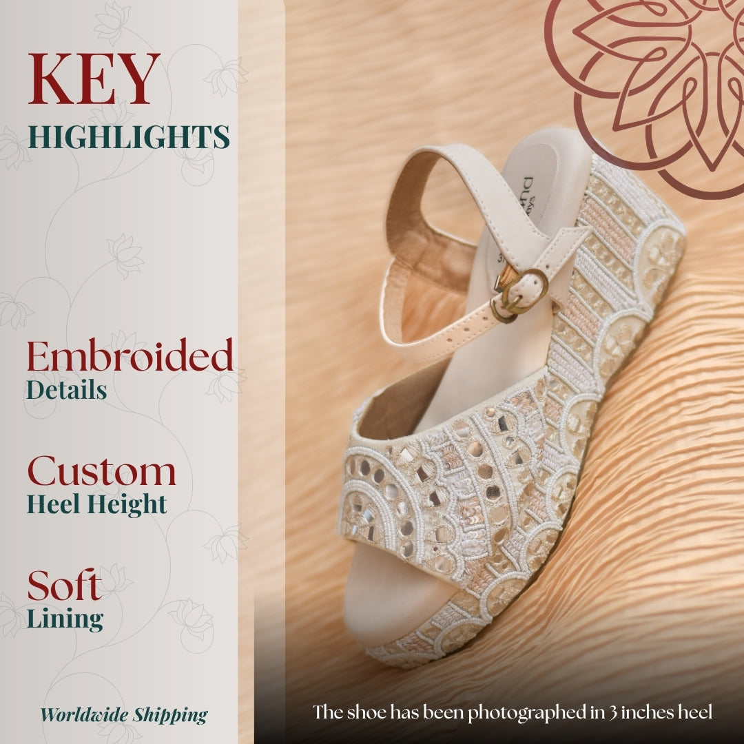 Designer ankle strap wedges with delicate handcrafted detailing and neutral tone finish