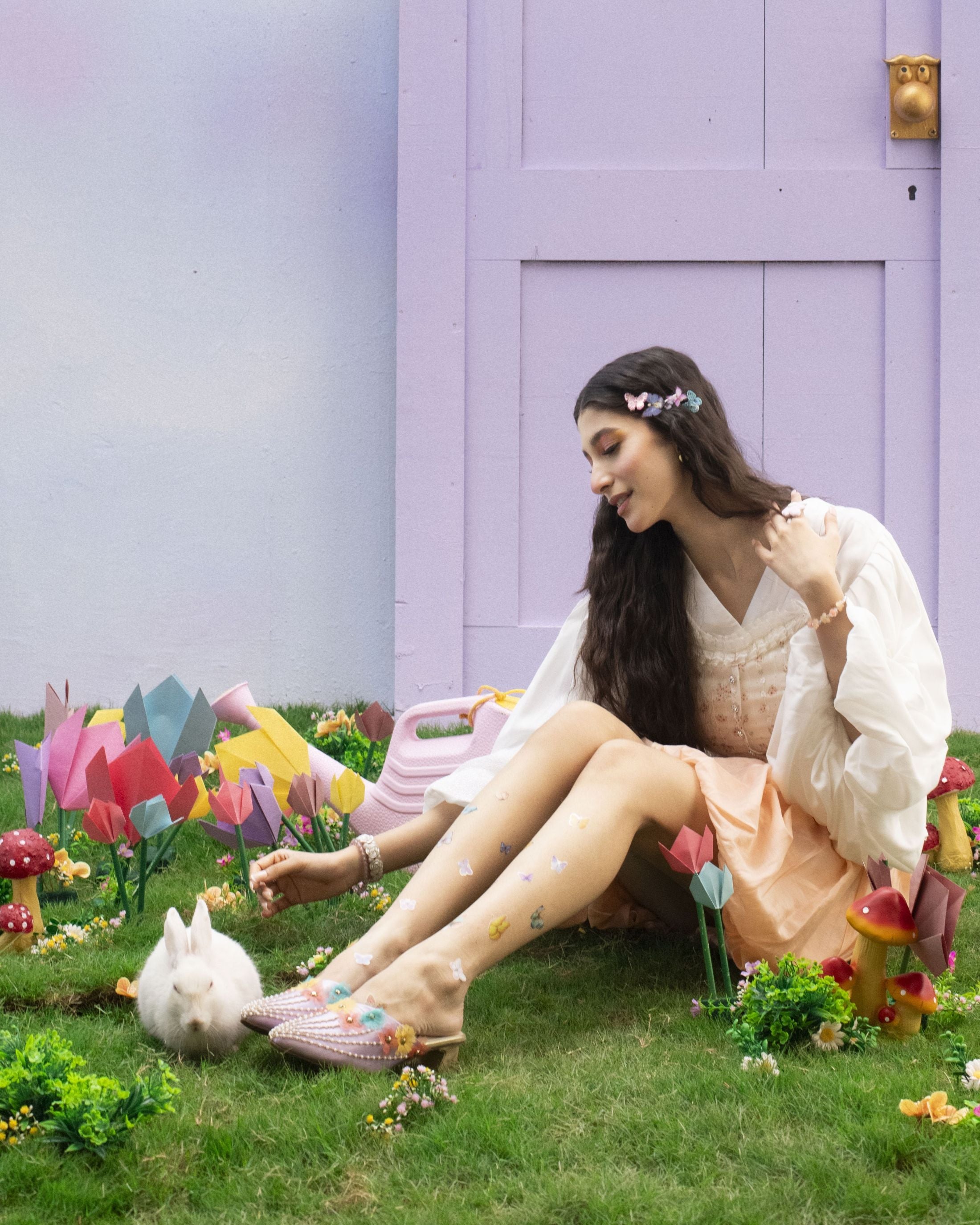 Emebllished pointed footwear with floral elements and pearl trails