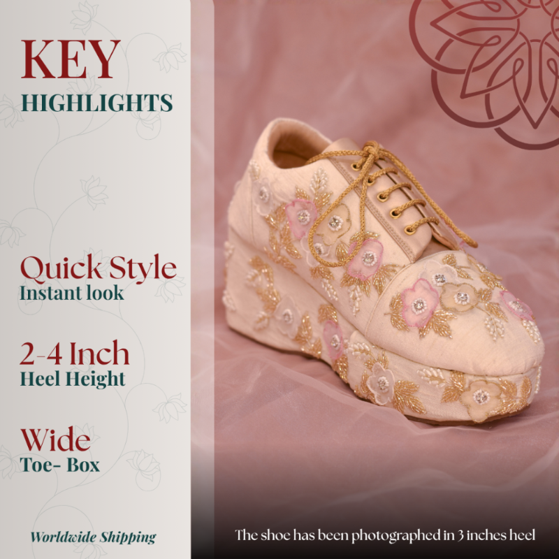 Blush pink embroidered wedge sneaker with floral threadwork, lace-up detail, and elevated platform sole