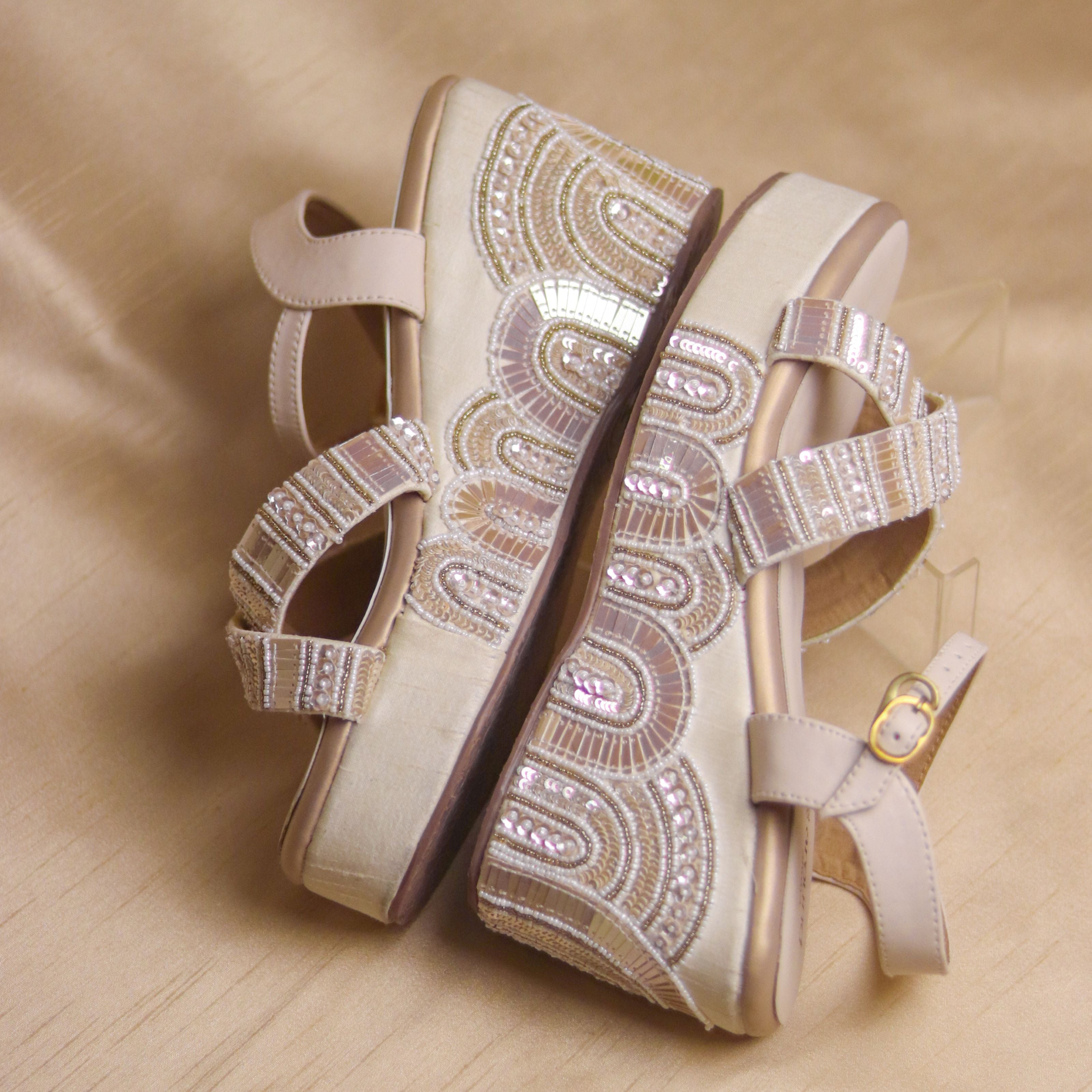 Comfortable handcrafted wedges for Indian brides in nude and gold tones