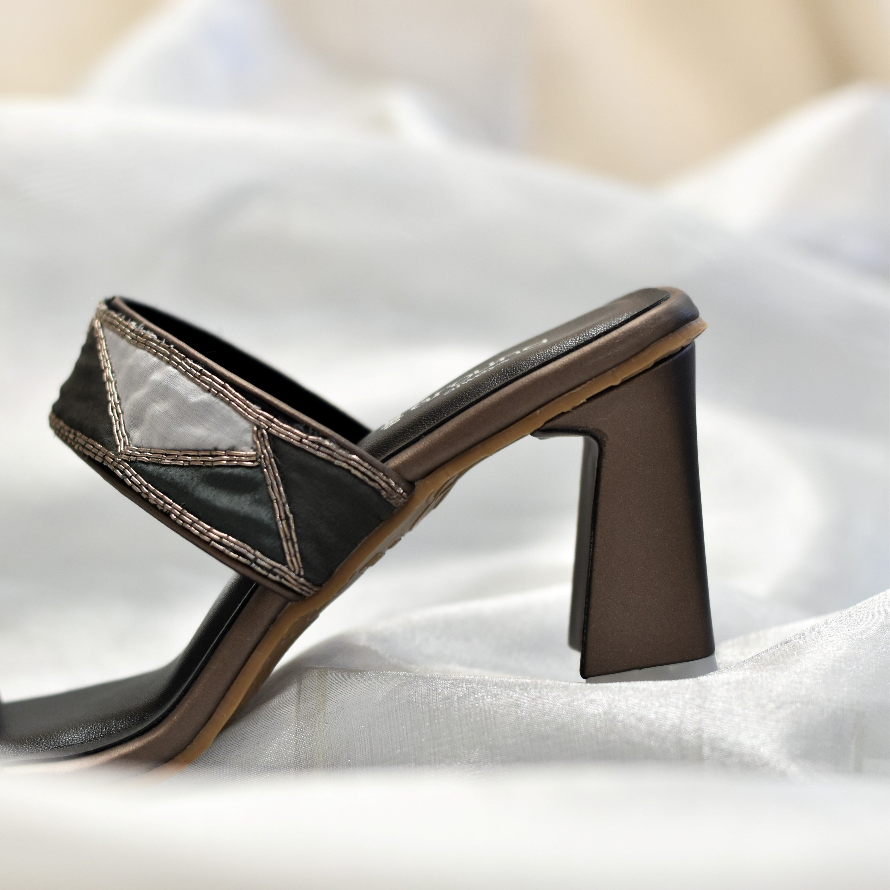 Flared high heel sandals in black tones with patchwork fabric strap