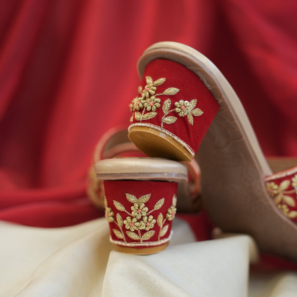 Red wedding sandals with ornate gold embroidered straps
