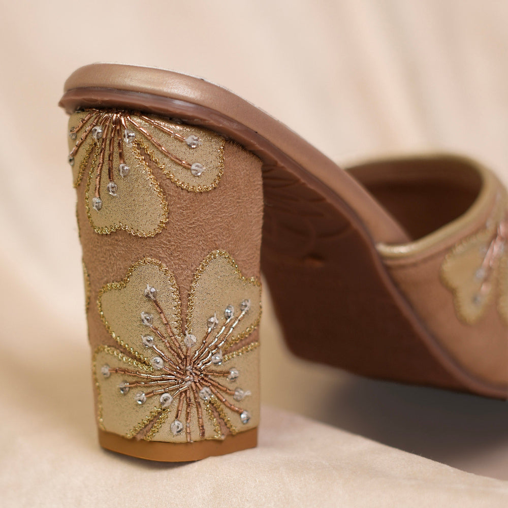 Blush-toned women’s block heel sandals for festive wear

