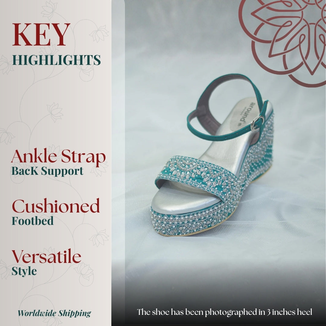 Teal embroidered wedge heels with ankle strap support, cushioned footbed and detailed handcrafted surface