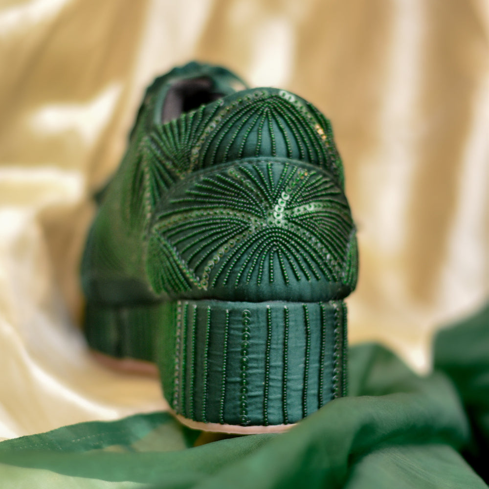 Deep green wedding sneakers with intricate tonal embellishment
