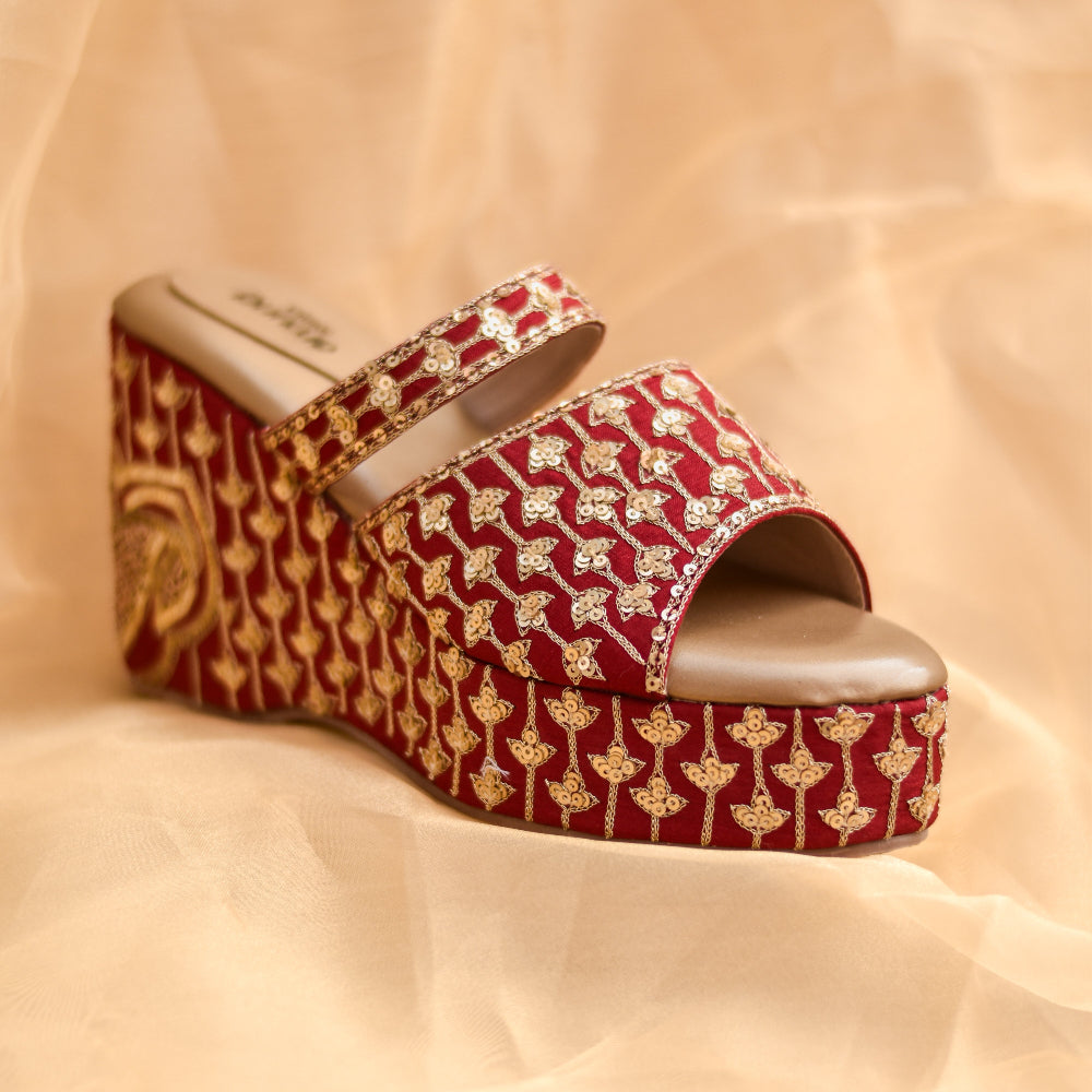Red bridal platform wedges with floral motif pattern on straps and base