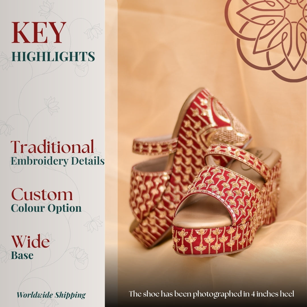 Red wedges with gold traditional motifs, double strap upper, open toe design, and sturdy platform base for festive statement wear