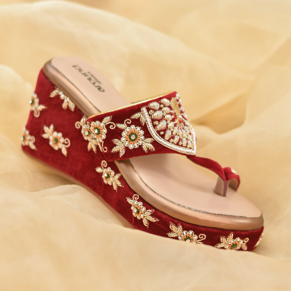Red occasion wedges on velvet base with cushioned insole and antislip sole