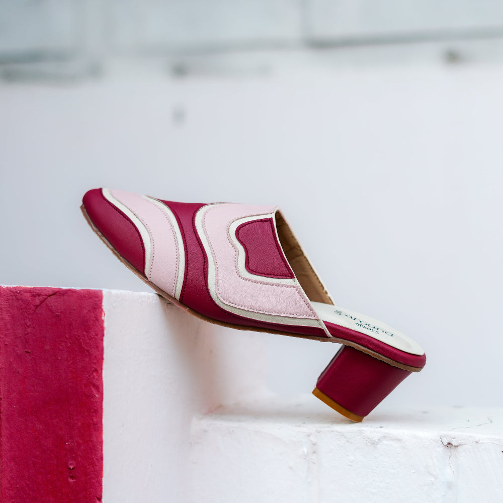 Contemporary mule with wave-inspired detailing and comfortable flat sole
