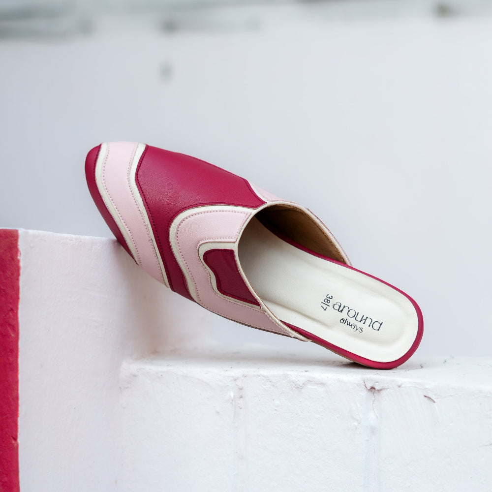 Burgundy and blush pink mule with curved colour-block detailing and pointed toe
