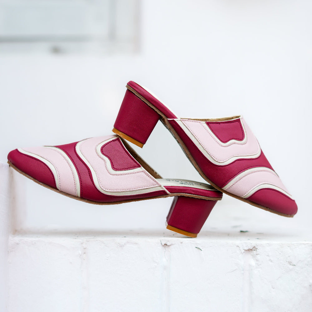 Colour-block mule featuring burgundy and blush shades with a pointed front
