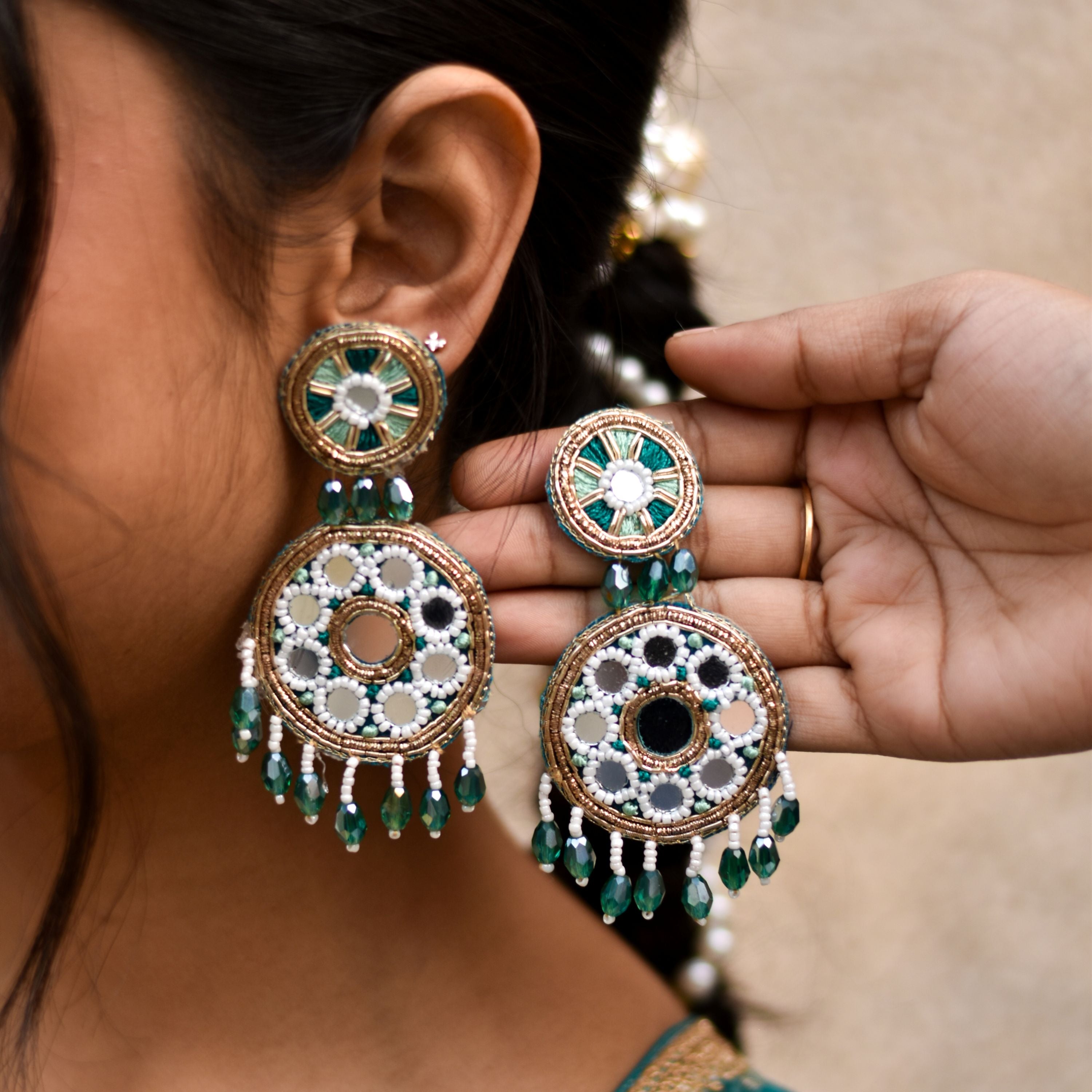 Intricate earrings with green and gold details crafted for long duration wear