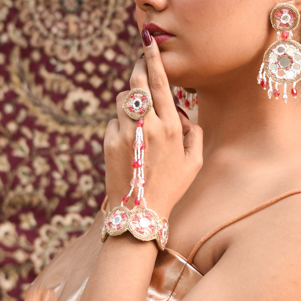 Dulhan wearing a ring and bracelet with on a trendy wedding outfit