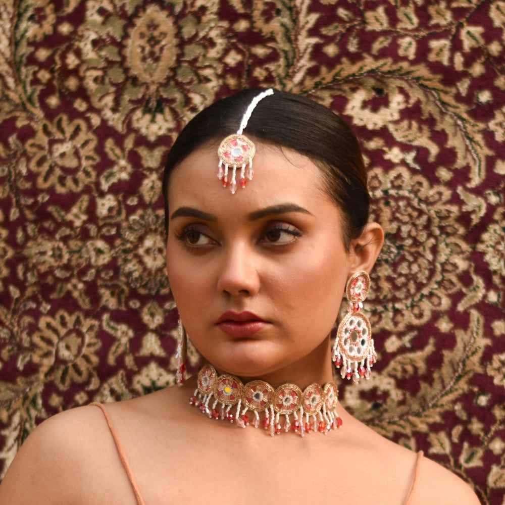 A stylish wedding pose by a bride in her imitation haldi jewellery set