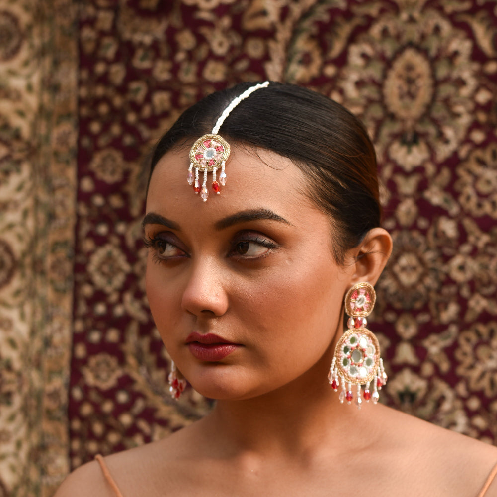 Woman wearing traditional imitation jewelry for her haldi and wedding celebration