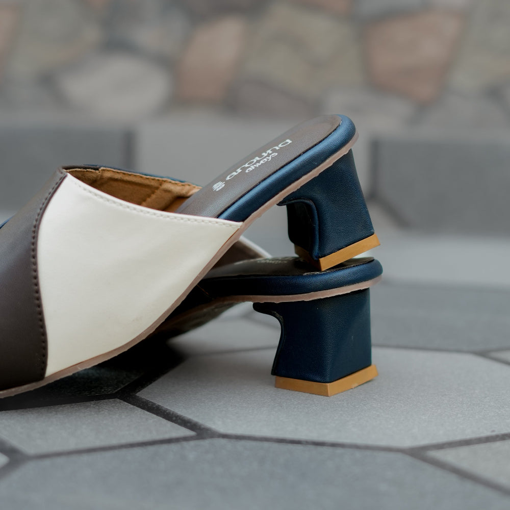 Elegant heeled mule with wave-inspired panel detailing and pointed front