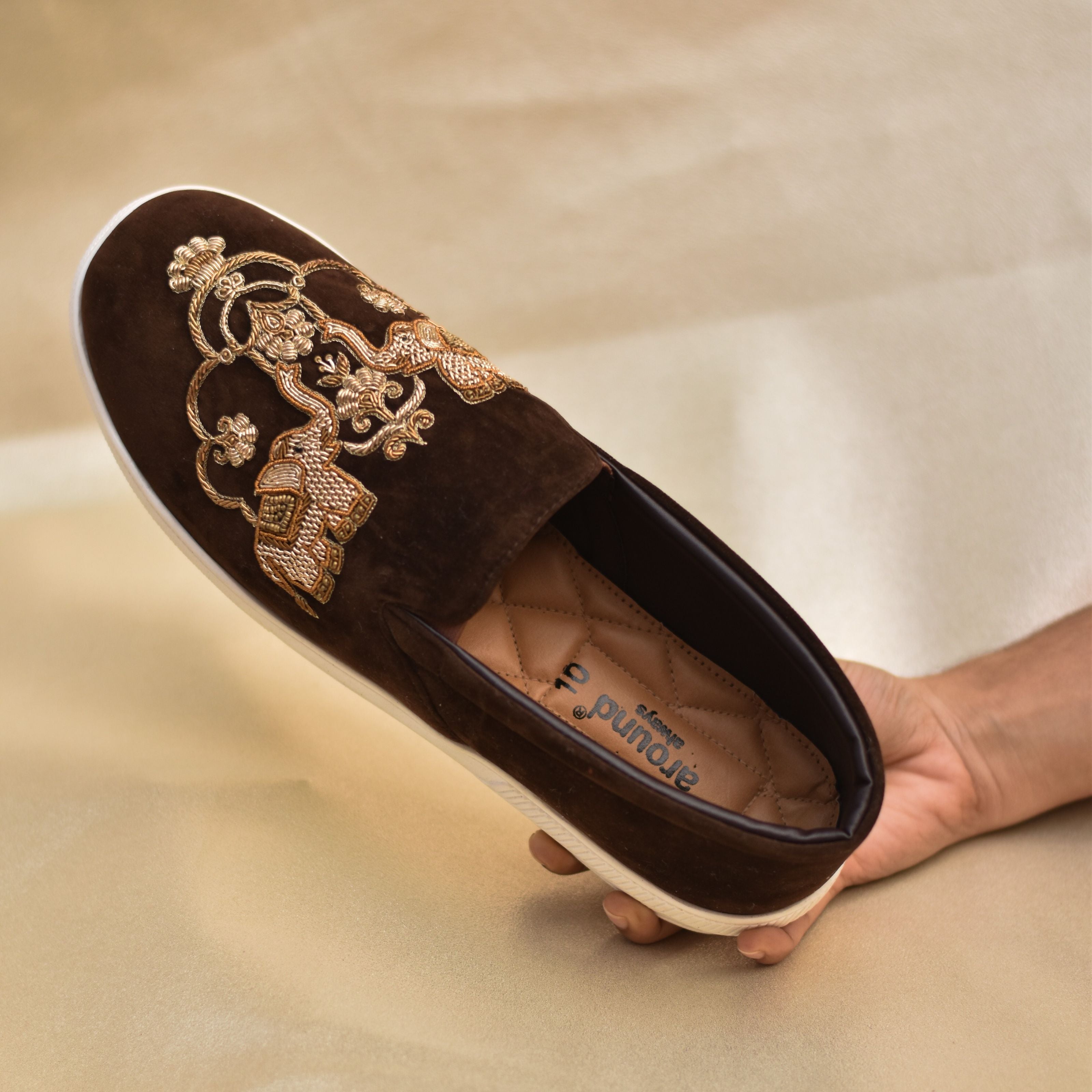 Brown royal wedding shoes with gold embroidery, perfect for baraat ceremonies.