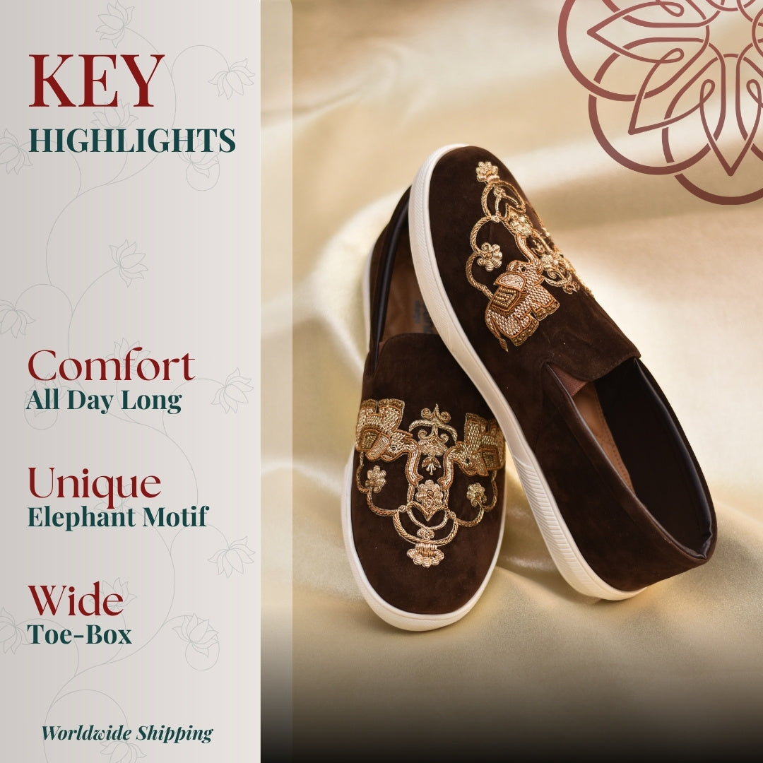 Brown slip on sneakers with golden elephant embroidery design