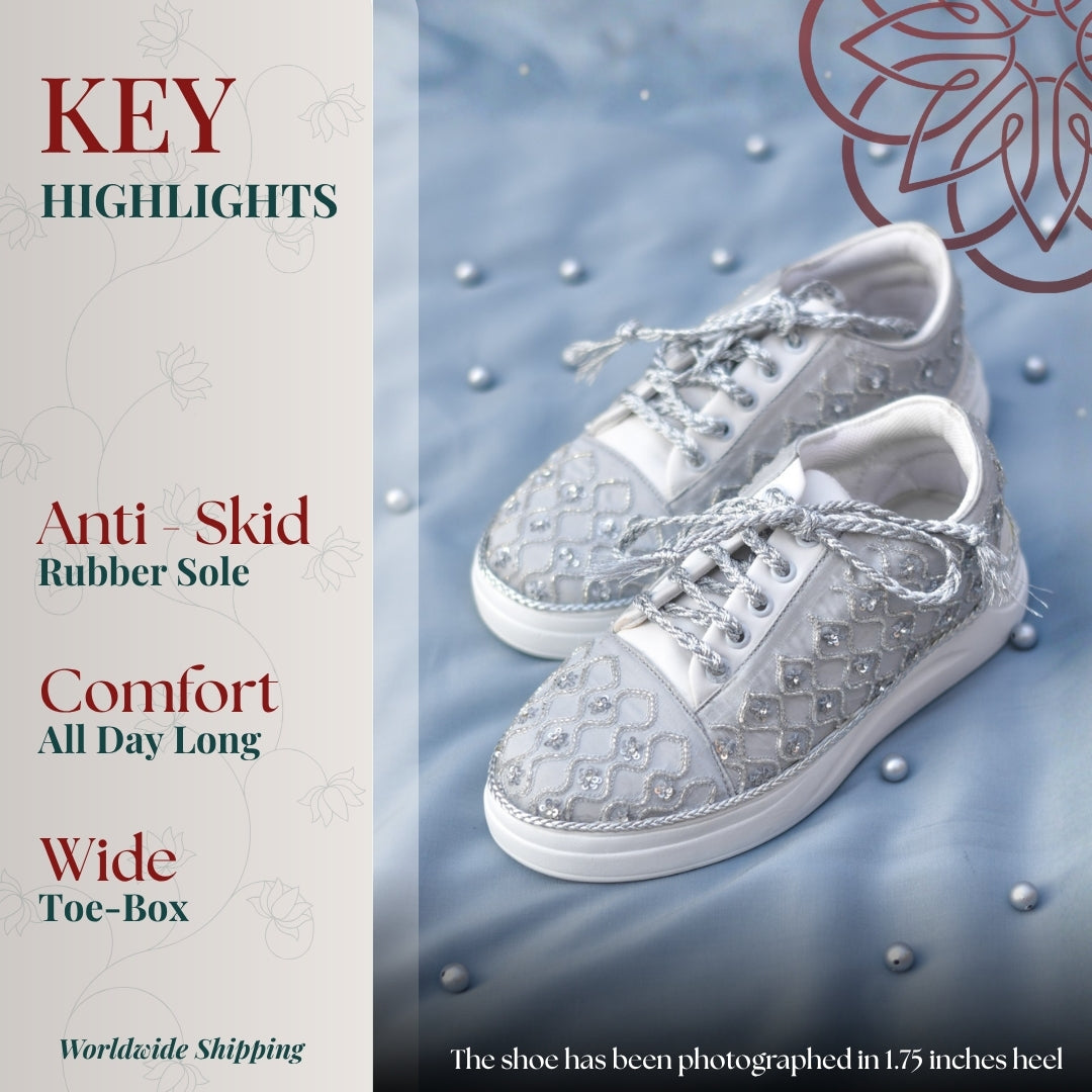 Silver embellished sneaker with intricate threadwork, padded comfort, and sturdy anti slip base for all day wear