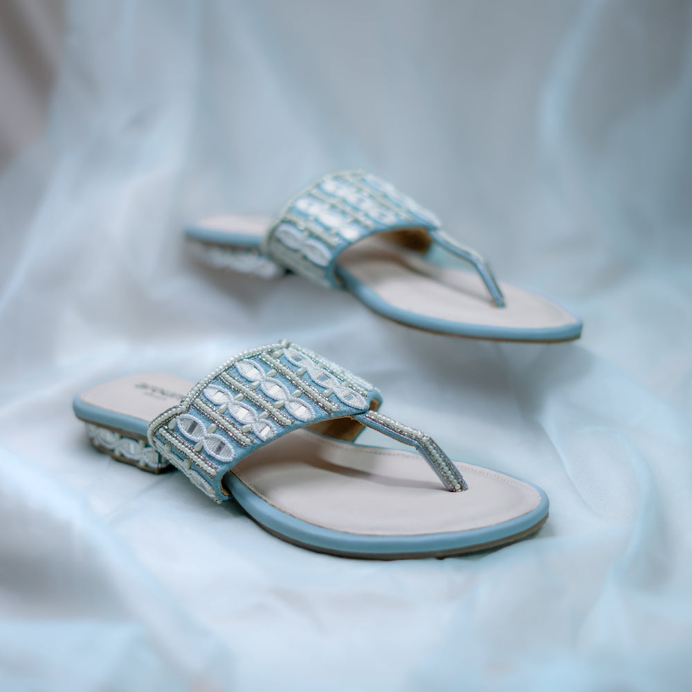 Pastel blue occasion sandals with detailed needlework and embellished heel design