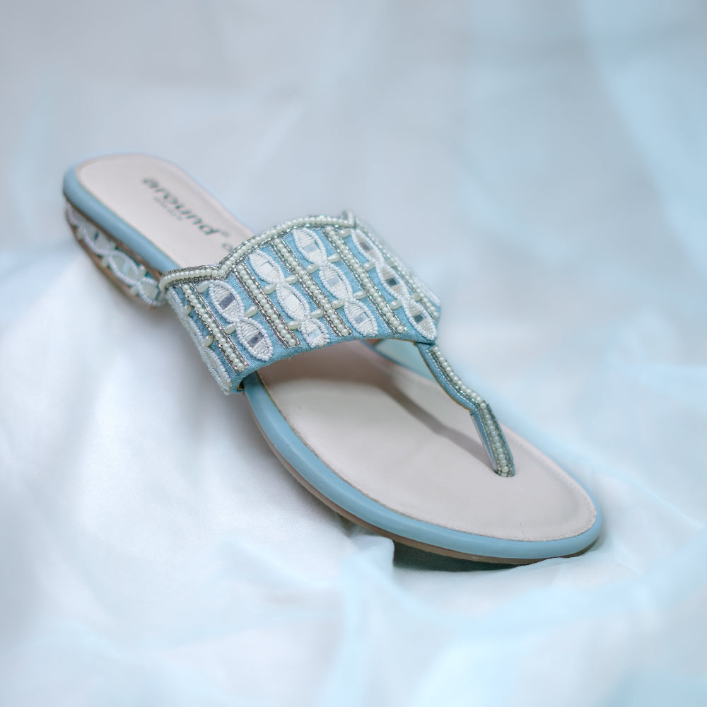 Powder blue  sandals with white thread embroidery and mirror work detailing
