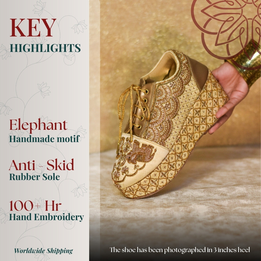 Couture wedding sneakers with intricate hand-embroidered elephant motif in golden tones