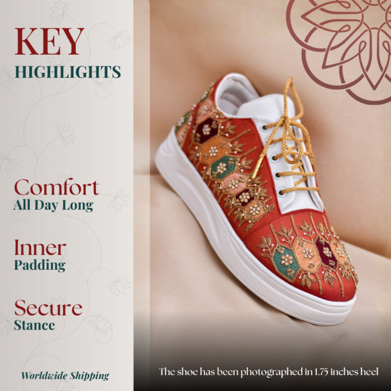 Red embroidered wedge sneaker with gold lace details and cushioned sole for all-day comfort