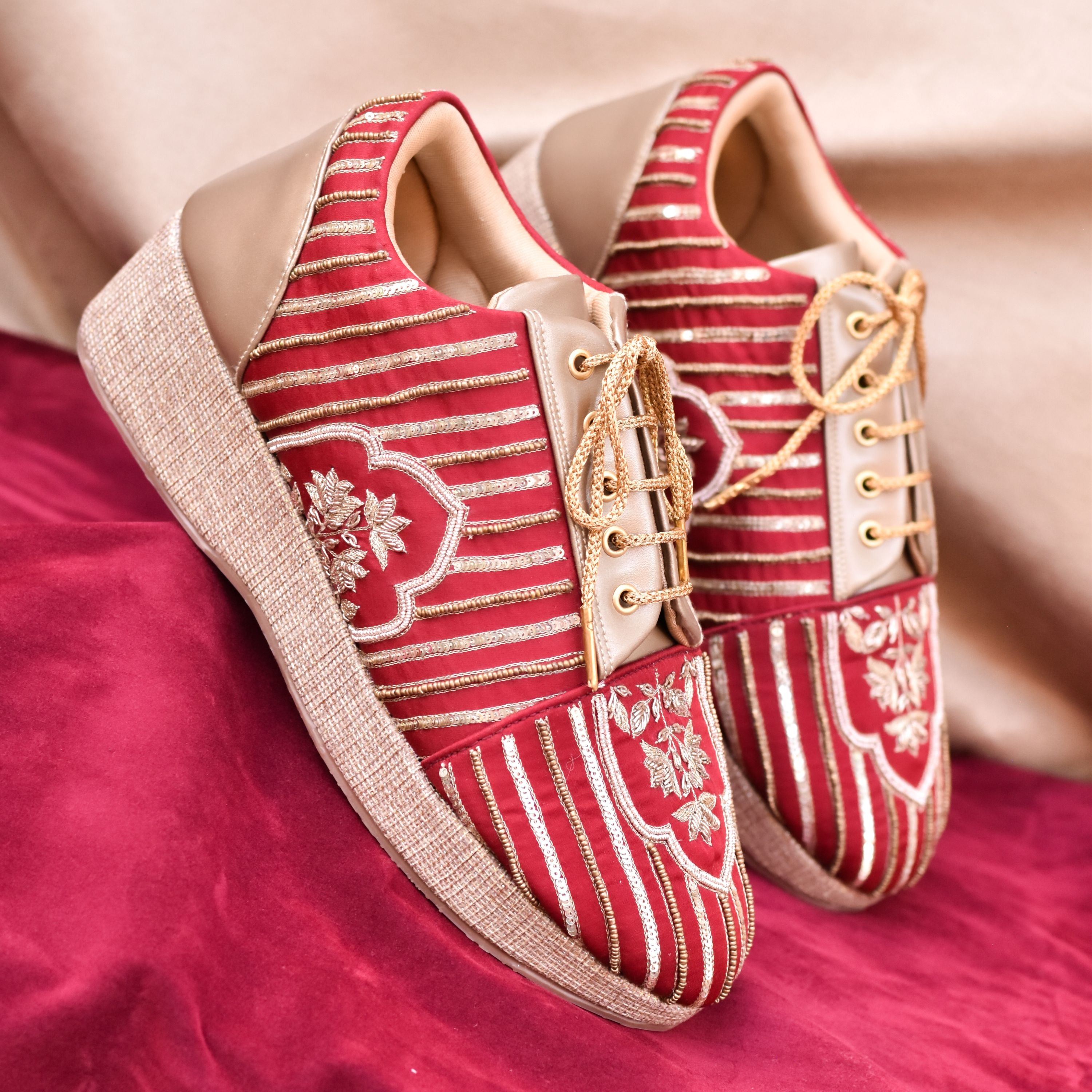 Designer bridal wedge sneakers with textured heels and laces.