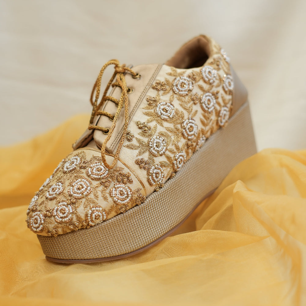 Golden floral sneaker wedge with gold and ivory detailing
