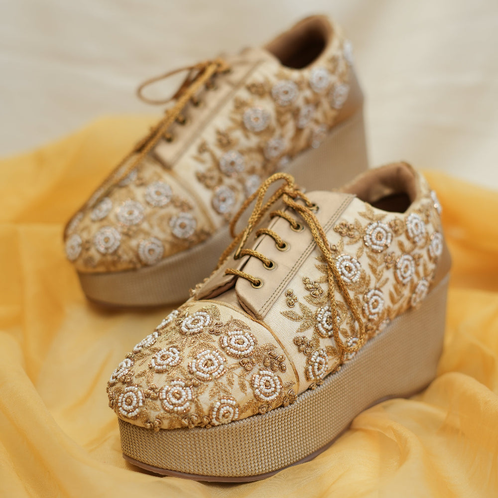 Golden Sneaker wedges with elevated sole and floral detailing
