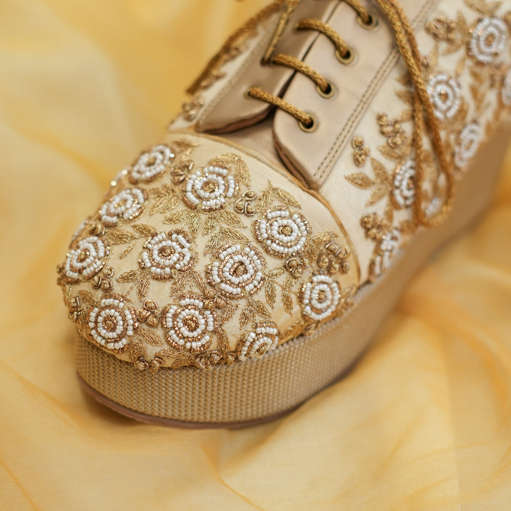 Champagne platform sneakers with zardozi embroidery and golden laces
