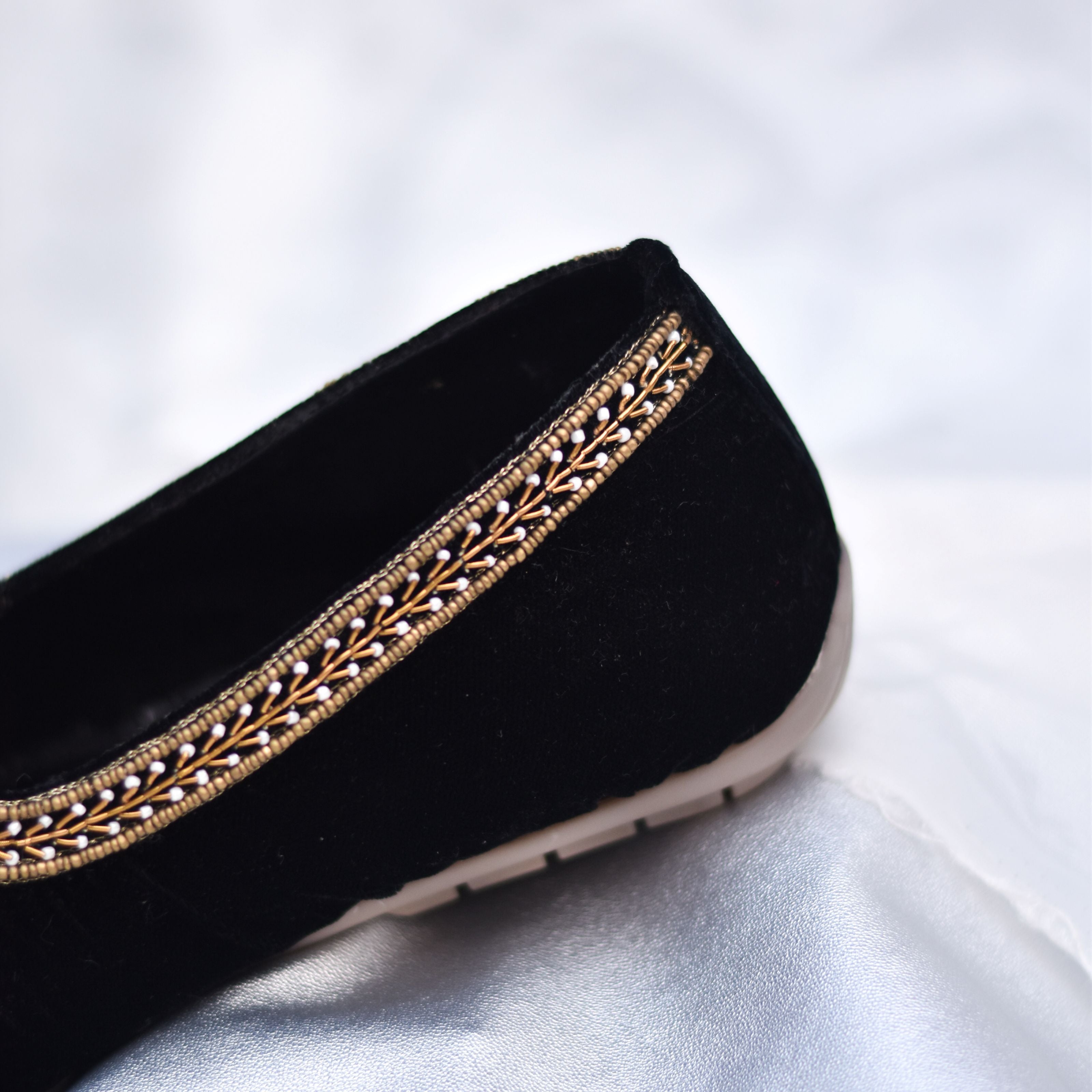 Comfortable black mojri with cushioned insole and classic yet modern silhouette.