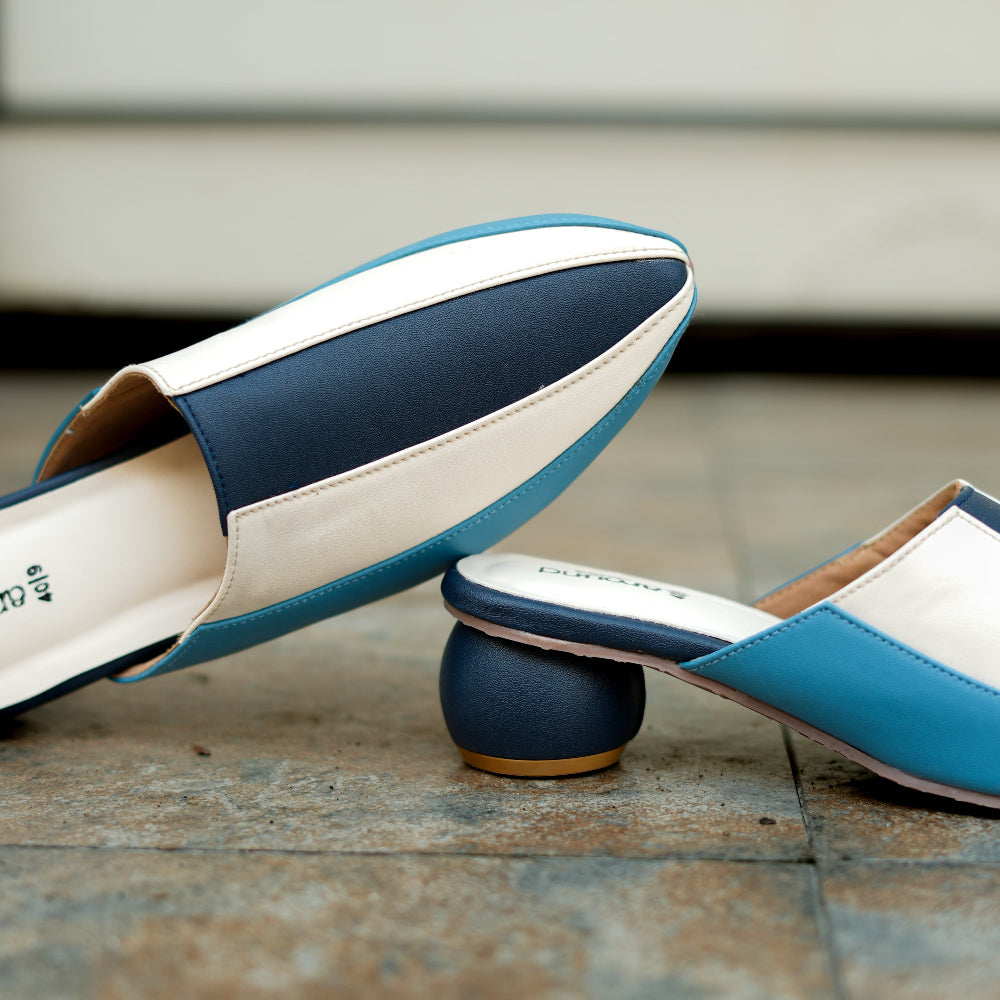 Contemporary mule in blue tones with sleek colour-block panels
