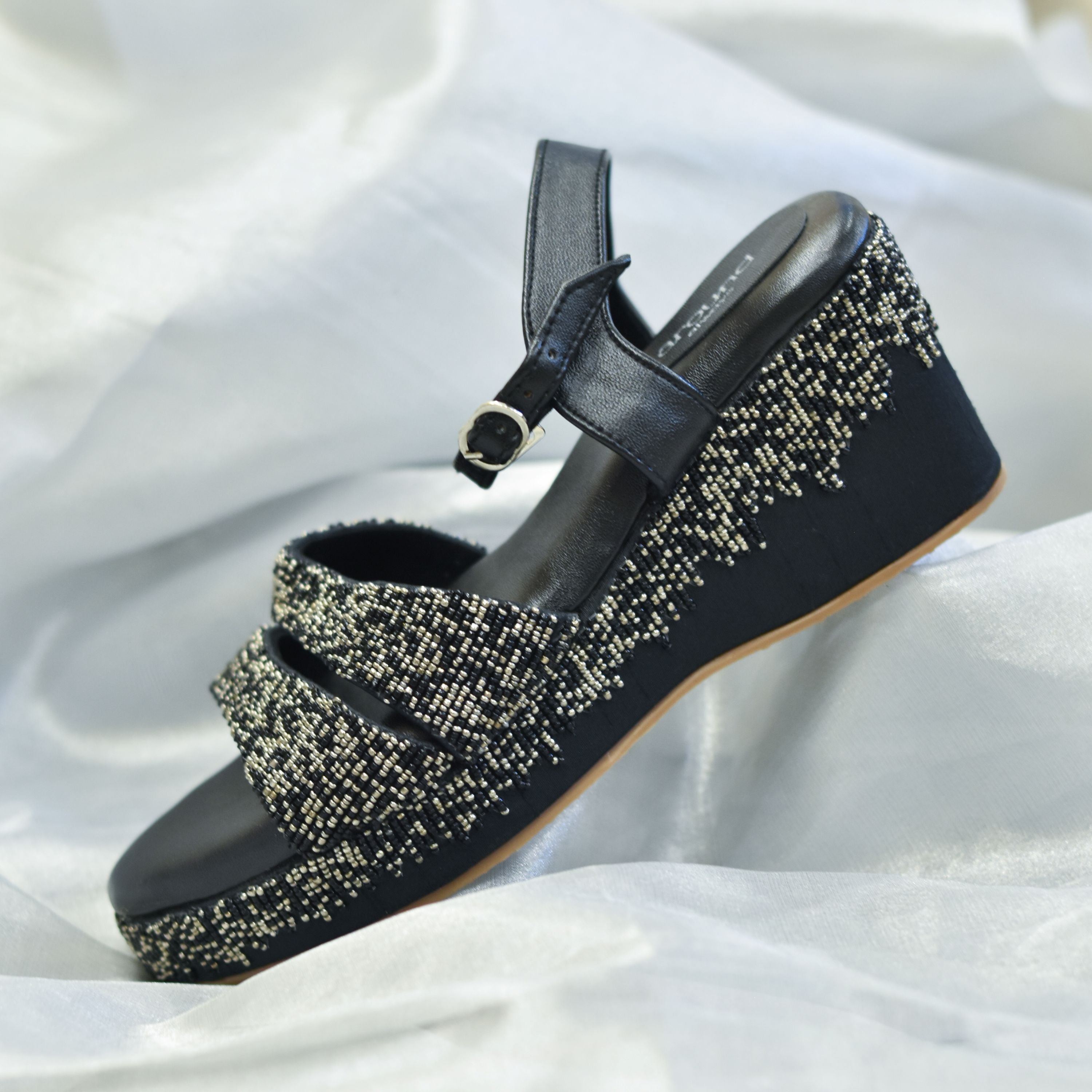 Black sandal with gun metal embellishments, cushioned insole and anti-slip sole